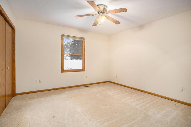 unfurnished room with ceiling fan and carpet flooring