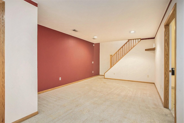 spare room with light colored carpet