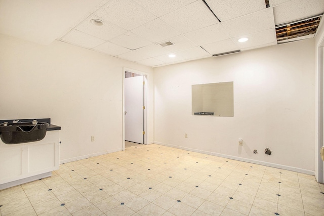 spare room with a paneled ceiling