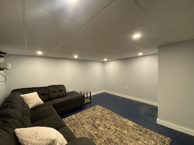 living room with a drop ceiling