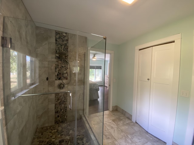 bathroom with a shower with shower door