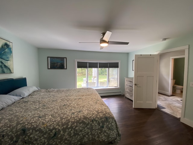 bedroom featuring dark hardwood / wood-style flooring, ceiling fan, and baseboard heating