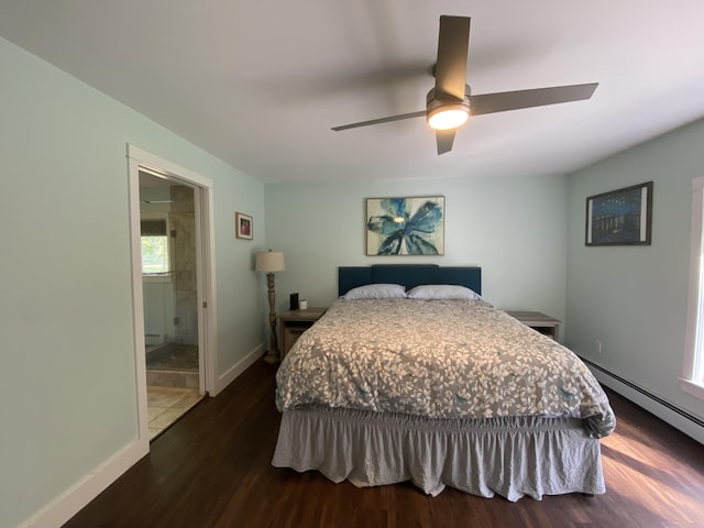 bedroom with dark wood-type flooring, ceiling fan, ensuite bath, and a baseboard heating unit