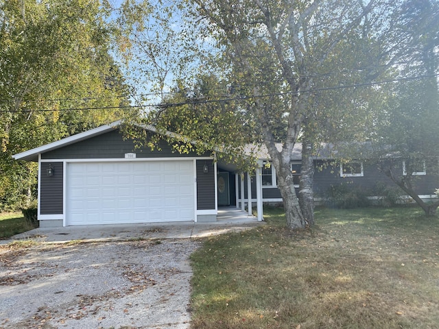 view of front of home with a garage and a front yard