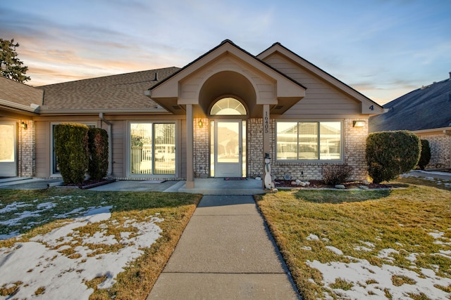 view of front of house with a lawn