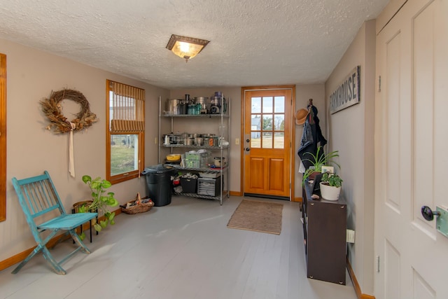 interior space with hardwood / wood-style floors and a textured ceiling