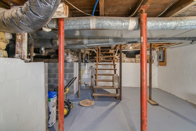 basement with gas water heater and electric panel