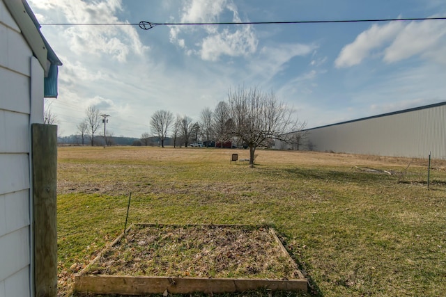 view of yard with a rural view