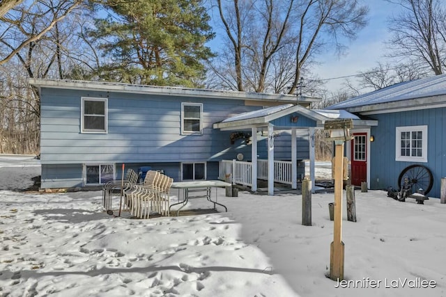 view of snow covered house