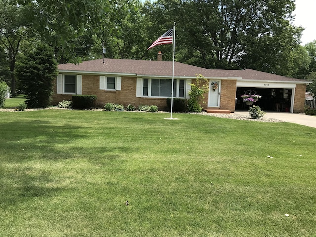 single story home with a garage and a front yard