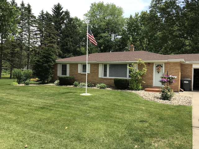 ranch-style house with a garage and a front yard