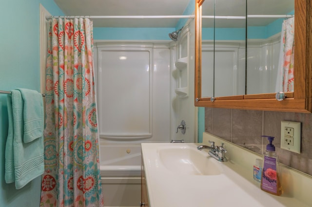 bathroom featuring vanity, shower / bathtub combination with curtain, and decorative backsplash