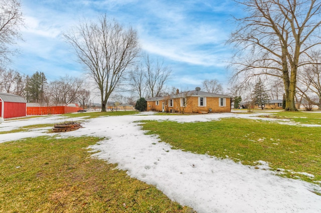 view of yard with a fire pit