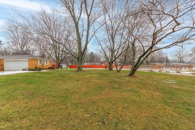 view of yard featuring a garage