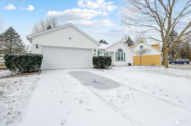 single story home featuring a garage