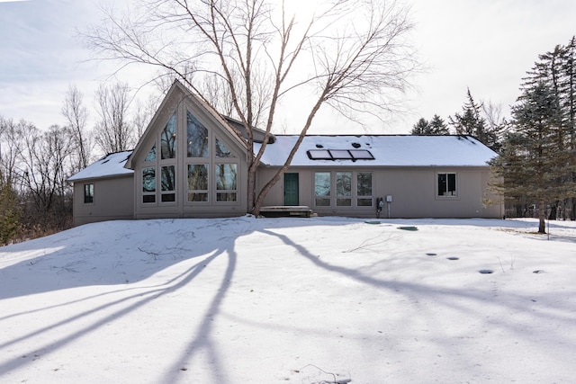 view of snow covered house