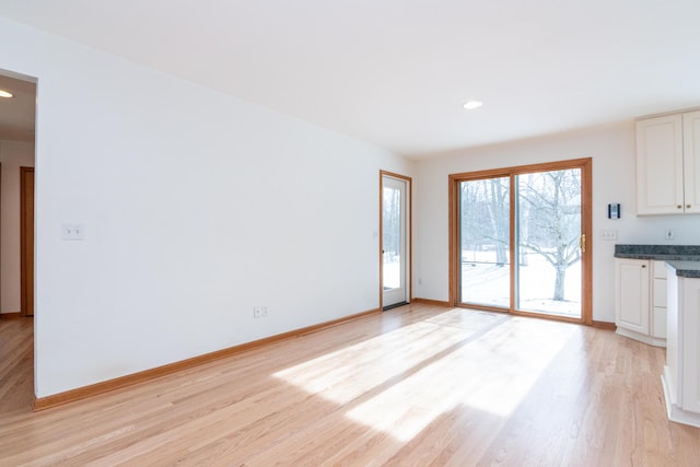 unfurnished living room with light wood-type flooring