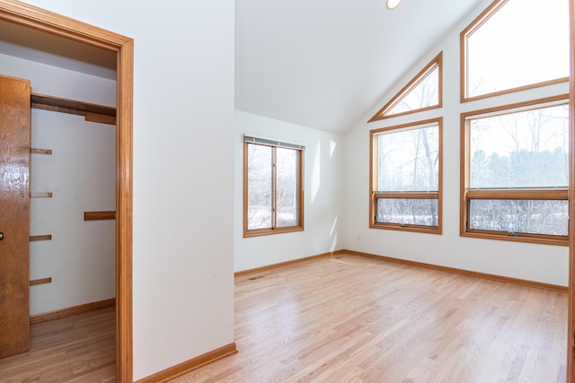 interior space with lofted ceiling and light wood-type flooring