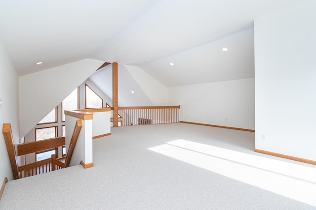 additional living space with lofted ceiling and carpet floors