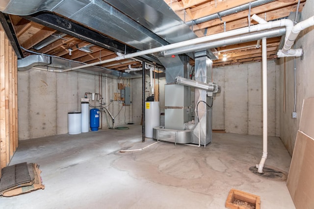 basement featuring water heater, heating unit, and electric panel