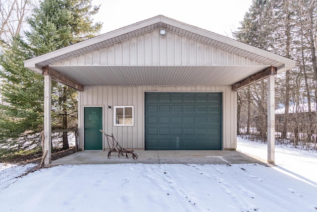 view of snow covered garage