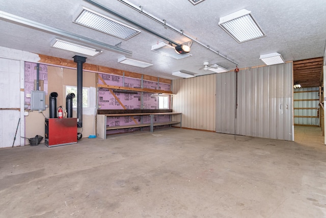 garage featuring a garage door opener and electric panel