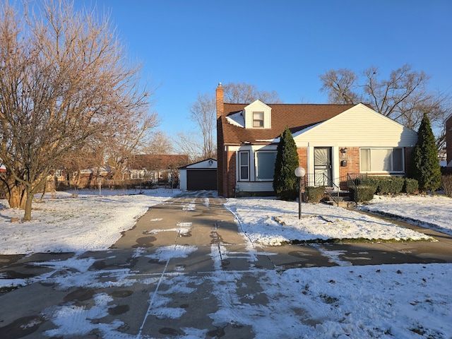 view of front of property featuring an outbuilding and a garage