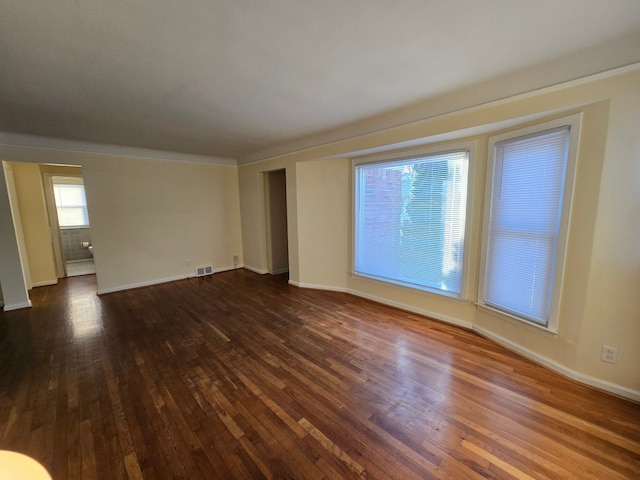 unfurnished room featuring dark hardwood / wood-style flooring