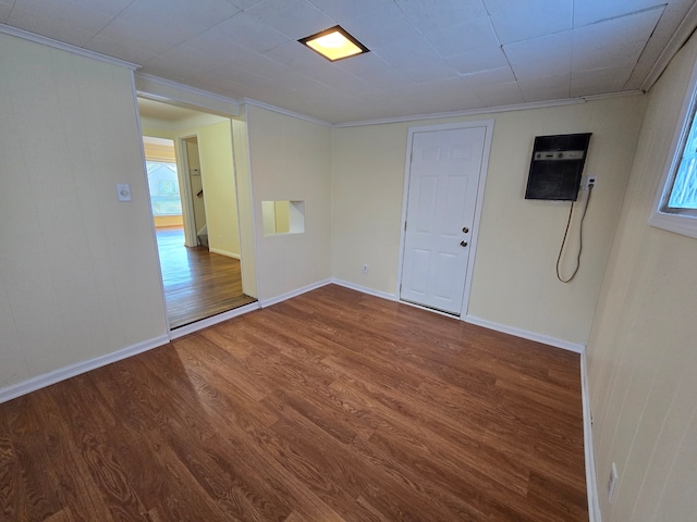 unfurnished room featuring hardwood / wood-style flooring and ornamental molding