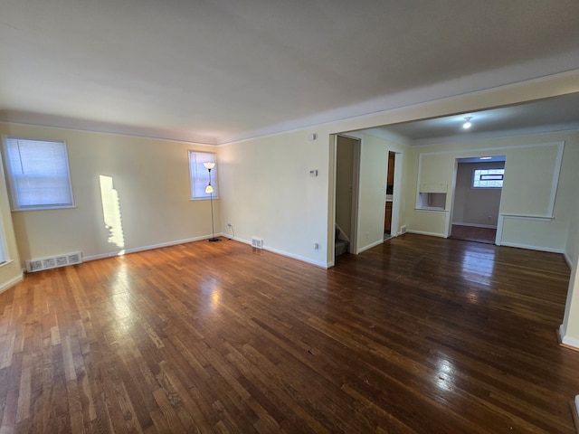 spare room with dark hardwood / wood-style floors