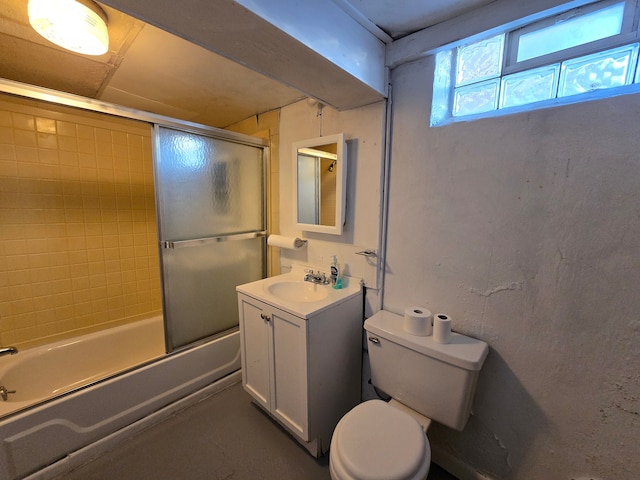 full bathroom featuring shower / bath combination with glass door, vanity, and toilet