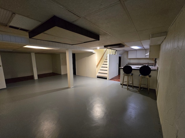 basement with a drop ceiling