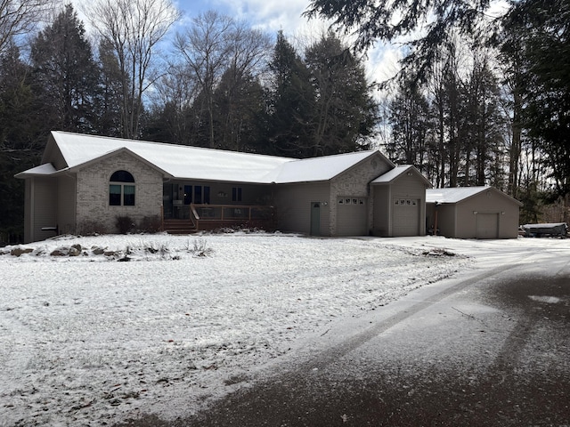 ranch-style home featuring a garage and covered porch