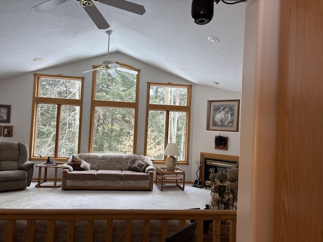 living room with lofted ceiling and carpet floors