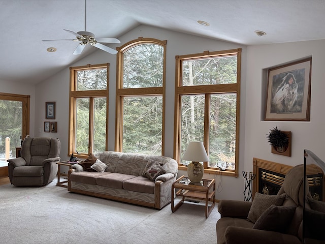 living room with light colored carpet, a fireplace, and vaulted ceiling