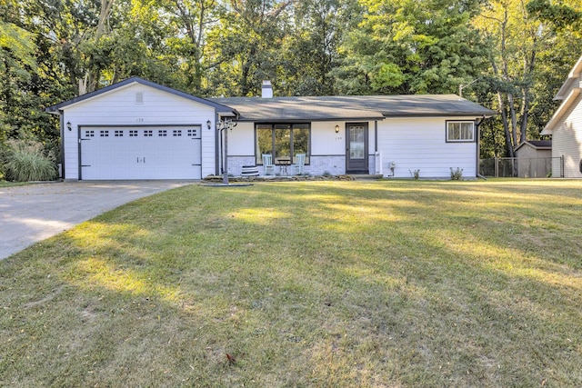 ranch-style house featuring a garage, covered porch, and a front lawn