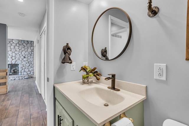 bathroom with vanity and hardwood / wood-style floors