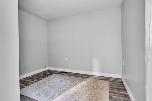 empty room featuring wood-type flooring