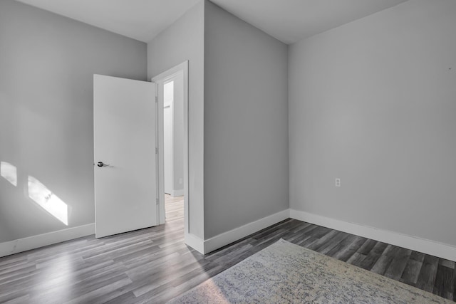 empty room with wood-type flooring