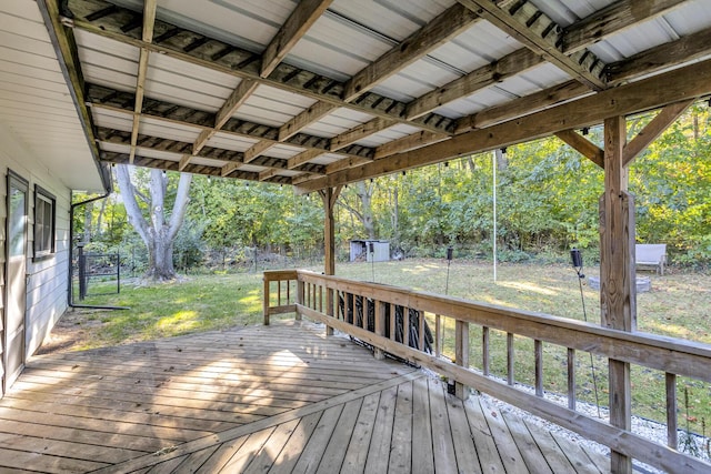 wooden deck featuring a yard