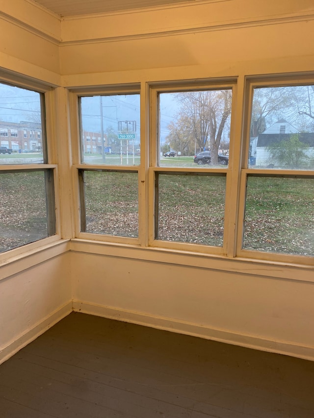 1192 S Belsay Rd, Burton, MI 48509 - unfurnished sunroom with hardwood / wood-style flooring and baseboards