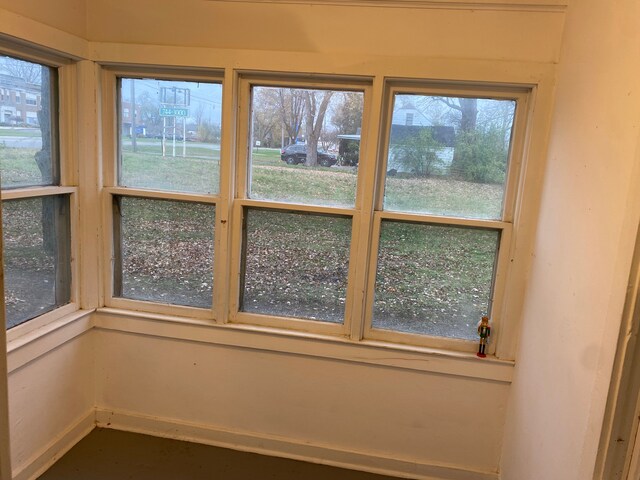 1192 S Belsay Rd, Burton, MI 48509 - unfurnished sunroom featuring baseboards