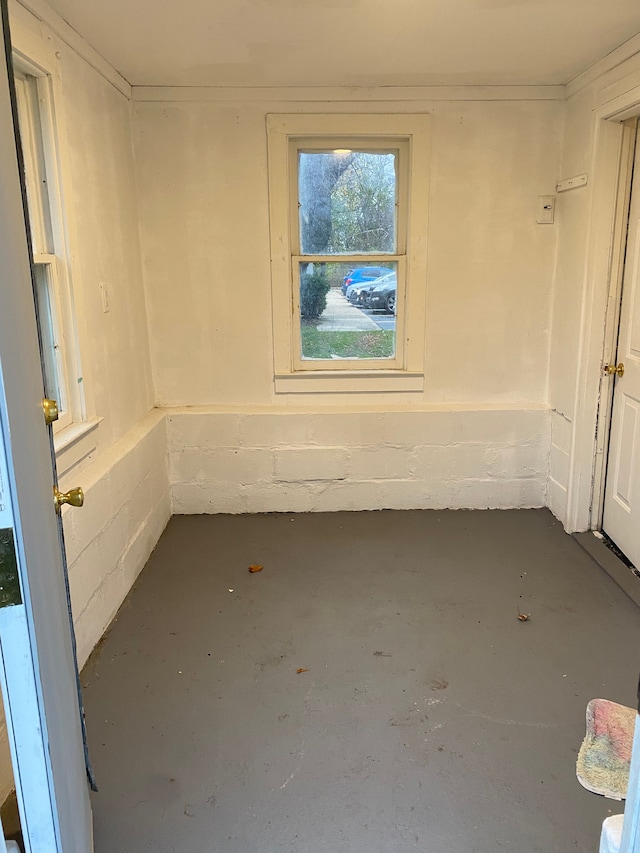 1192 S Belsay Rd, Burton, MI 48509 - empty room featuring concrete flooring