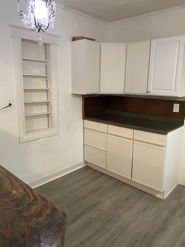 1192 S Belsay Rd, Burton, MI 48509 - kitchen featuring white cabinets, dark wood-style flooring, baseboards, a chandelier, and a textured wall