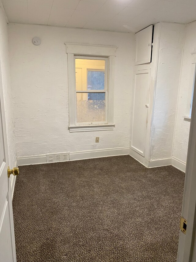 1192 S Belsay Rd, Burton, MI 48509 - carpeted empty room with baseboards