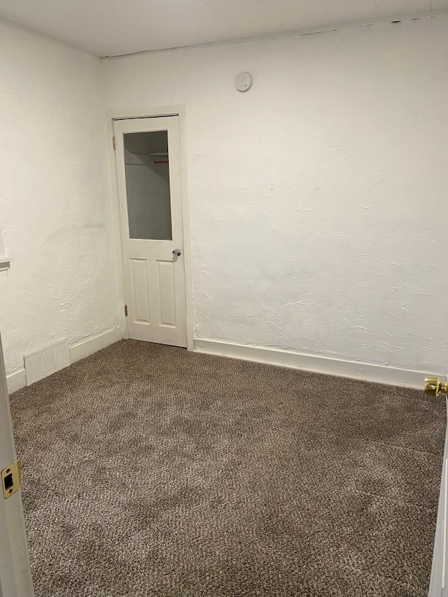 1192 S Belsay Rd, Burton, MI 48509 - carpeted spare room with a smoke detector