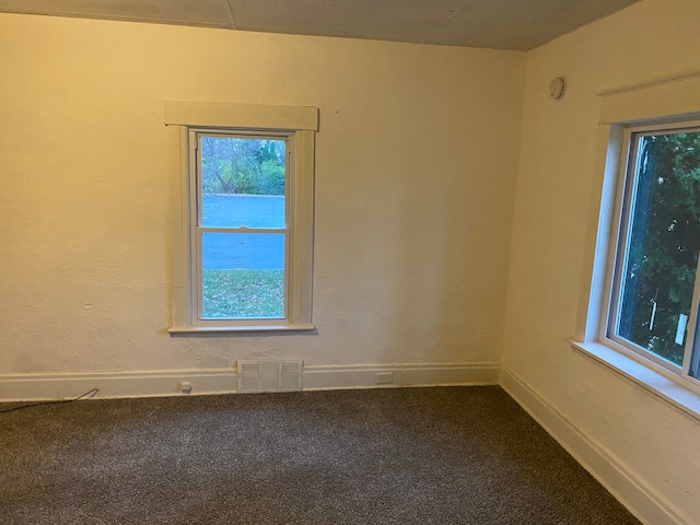 1192 S Belsay Rd, Burton, MI 48509 - carpeted empty room featuring baseboards