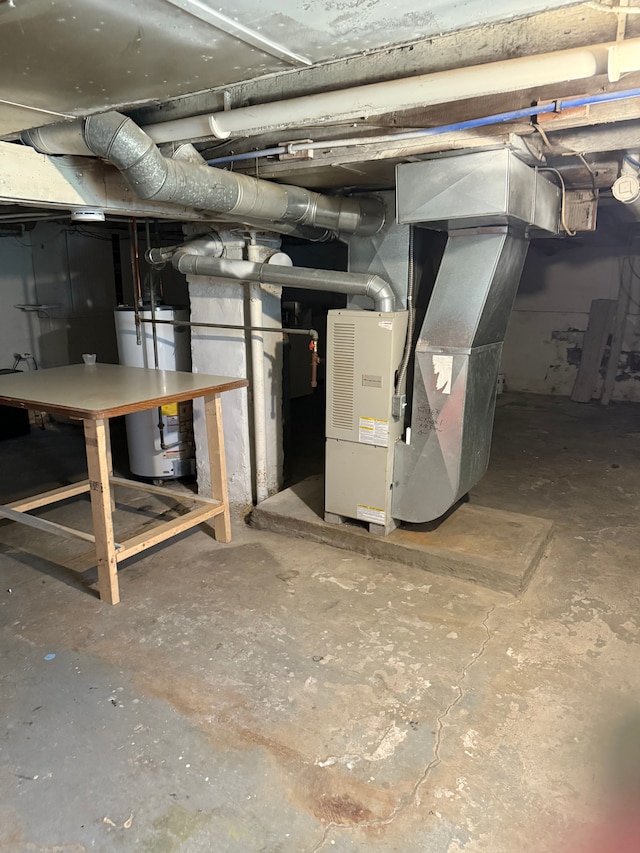 1192 S Belsay Rd, Burton, MI 48509 - unfinished basement featuring gas water heater and heating unit