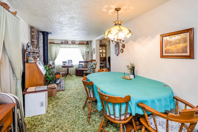 carpeted dining space featuring a textured ceiling and a wood stove