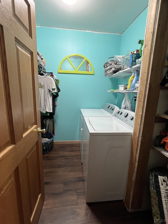 laundry area with washing machine and dryer and dark hardwood / wood-style floors